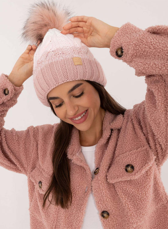 Pink hat with inner padding and pompom