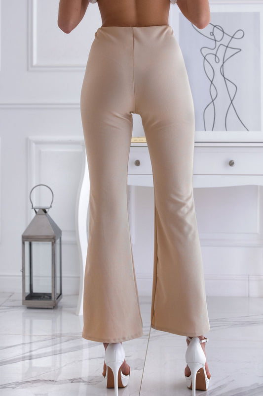 Beige flared trousers with front slit