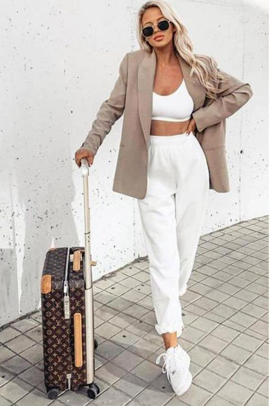 White jumpsuit trousers with pockets and springs