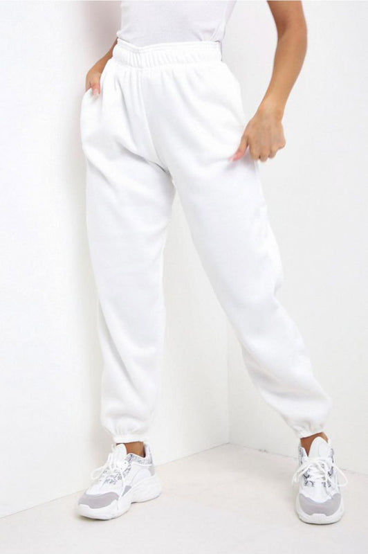 White jumpsuit trousers with pockets and springs