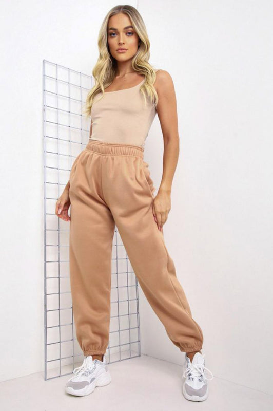 Camel jumpsuit trousers with pockets and springs