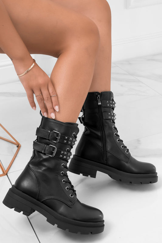 NEVIA - Black ankle boots with studs and buckles