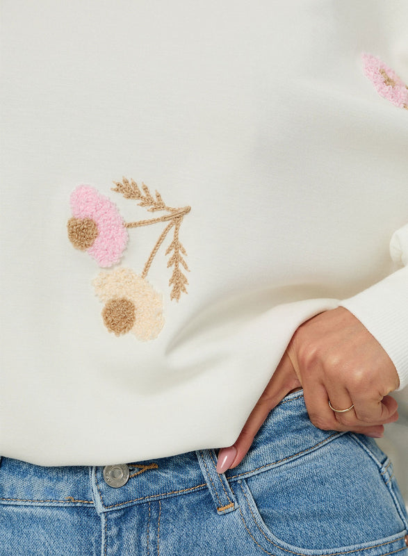 Oversized cream sweater with floral embroidery