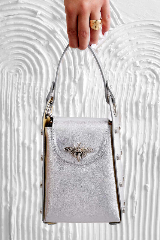 Metallic silver handbag with studs and removable shoulder strap