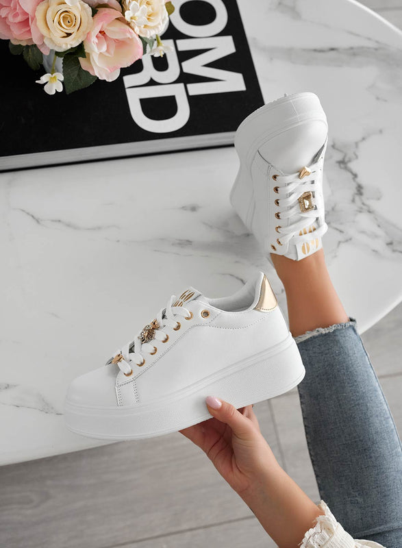 White sneakers with jewel appliqués and gold heel