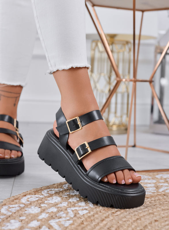 MORA - Black chunky sandals with double gold buckle and lug sole