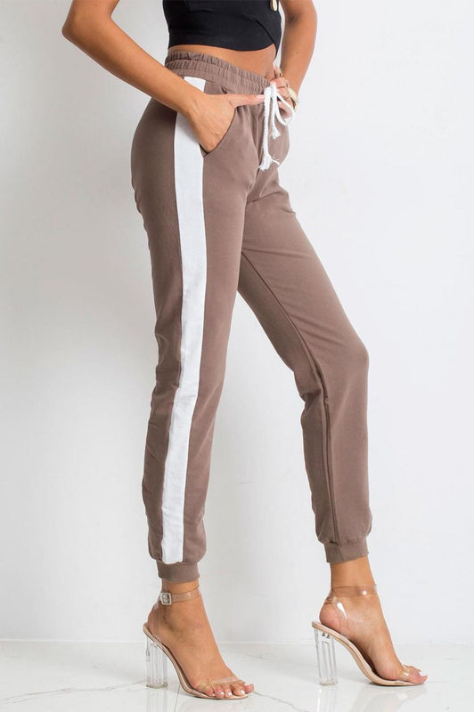 Brown sports trousers with contrasting white band