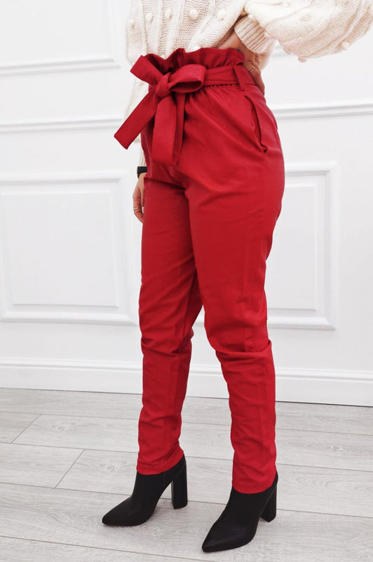 Red faux leather trousers with lace