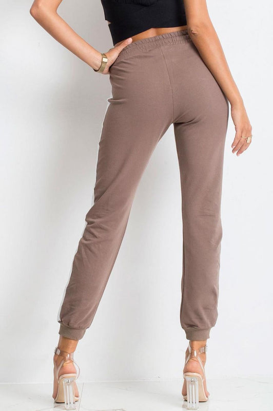Brown sports trousers with contrasting white band