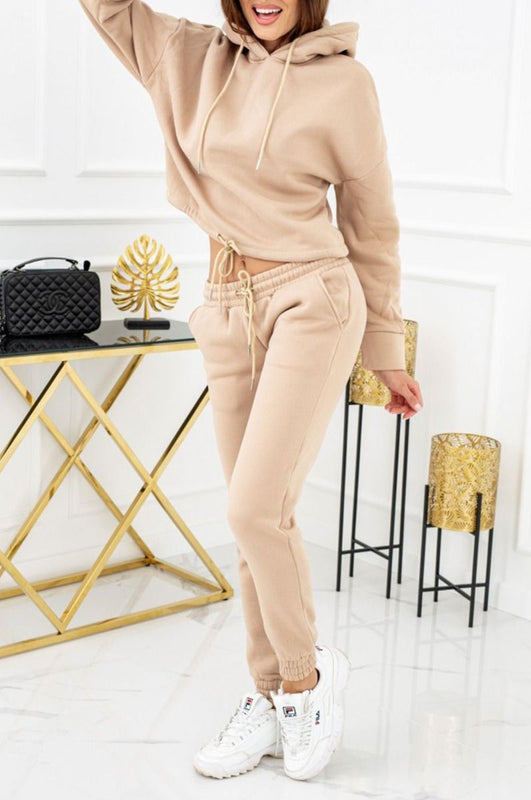 Beige two-piece jumpsuit with laces and hood