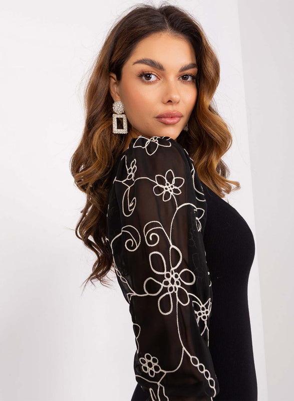 Black dress with sheer sleeves and embroidery