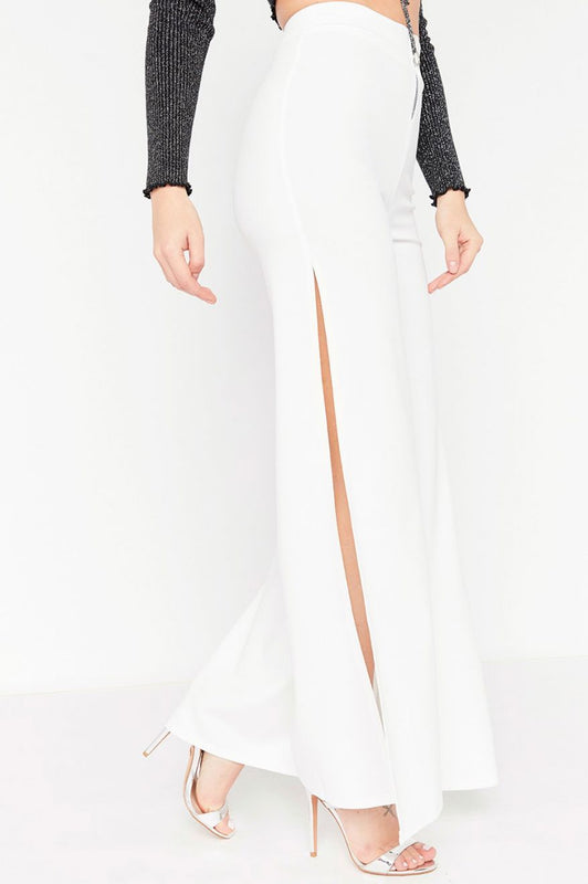 White trousers with zip and side slits