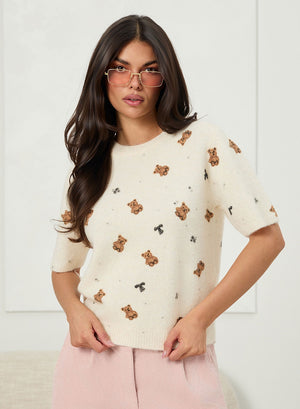 Soft beige sweater with teddy pattern