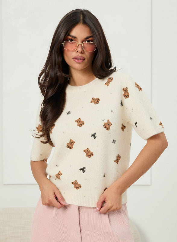 Soft beige sweater with teddy pattern