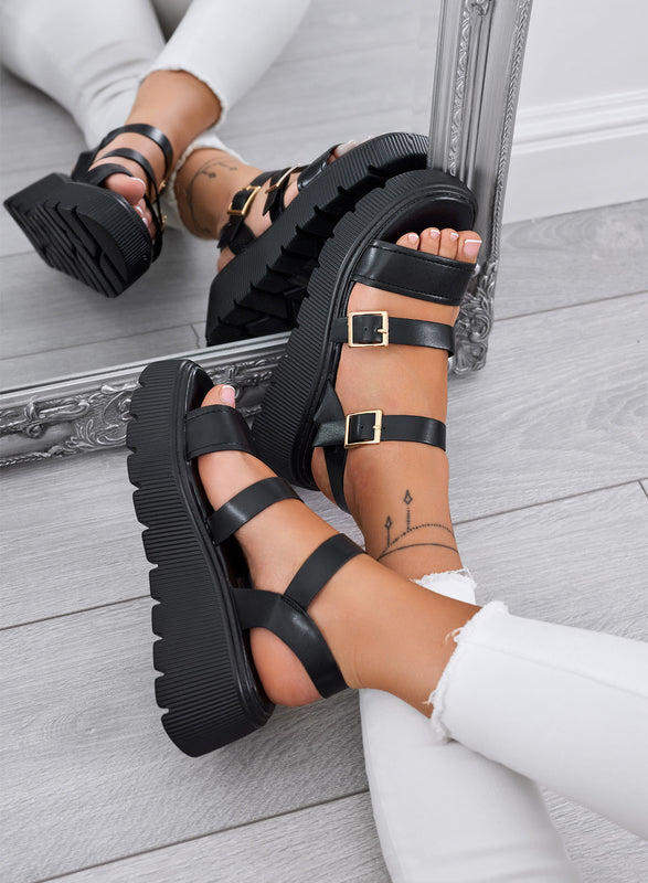 MORA - Black chunky sandals with double gold buckle and lug sole