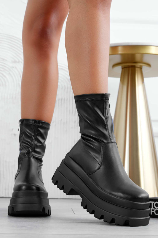 Black ankle boots with high wedge
