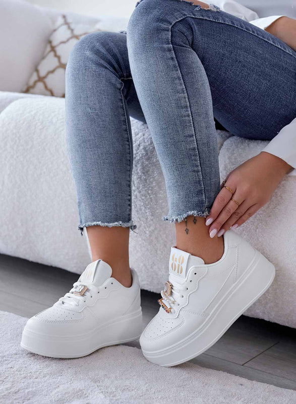 White sneakers with jewel embellishments