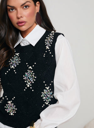 White shirt with black vest decorated with sequins and beads