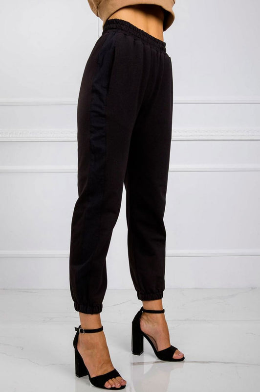 Black jumpsuit trousers with springs