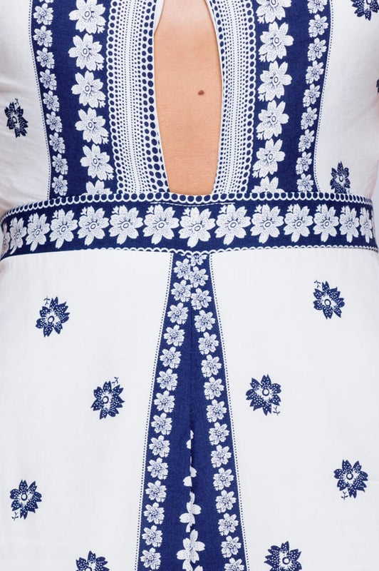 Blue and white short jumpsuit with crossover neckline