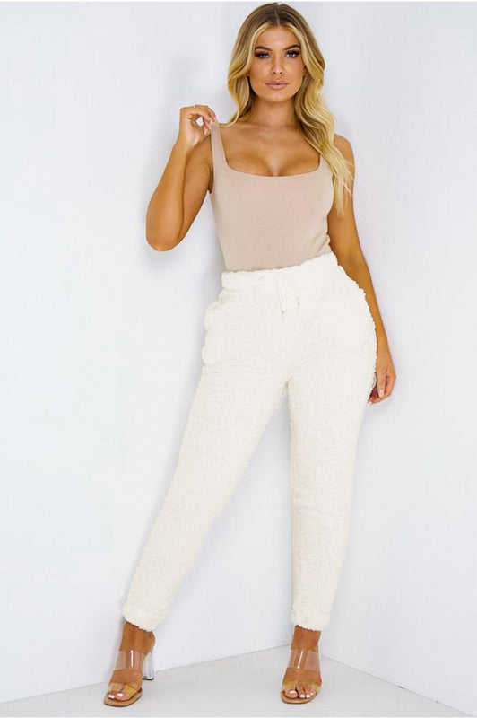 Beige jumpsuit trousers with fur and drawstring