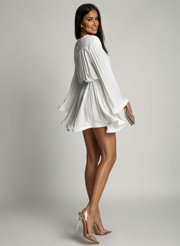 White pleated dress with a waist tie