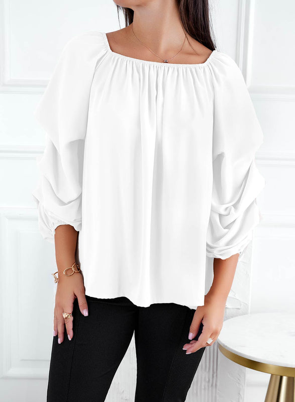 White blouse with ruffled sleeves