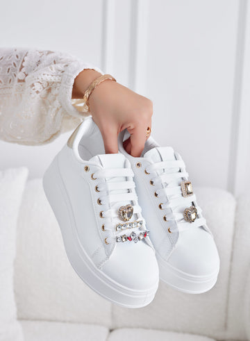 White sneakers with gold heel and jewel embellishments