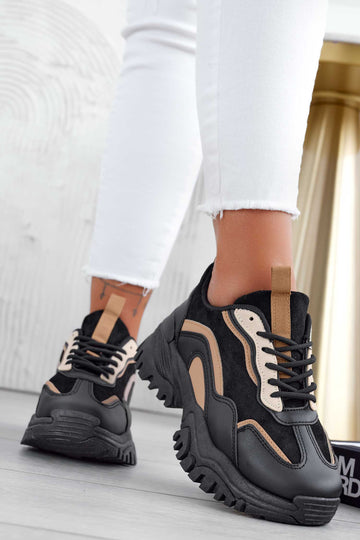 Black sneakers with thick sole and laces