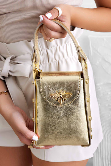 Metallic gold handbag with studs and removable shoulder strap