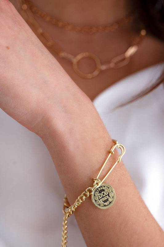 Gold bracelet with pendant