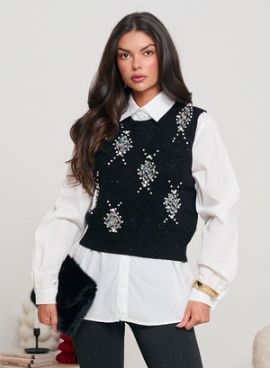 White shirt with black vest decorated with sequins and beads