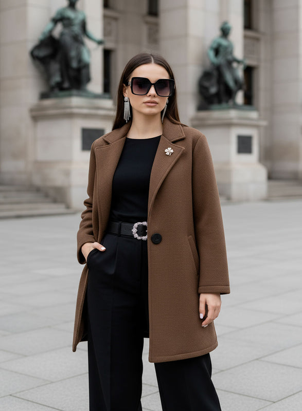 Brown coat with black button and brooch