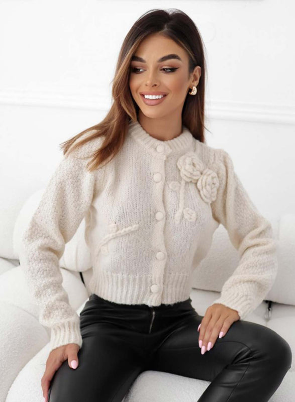 Beige knit cardigan with floral appliqué
