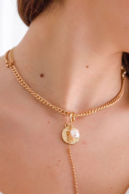 Gold necklace with pendant and pearl