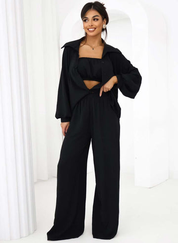 Three-piece black set consisting of shirt, top, and trousers