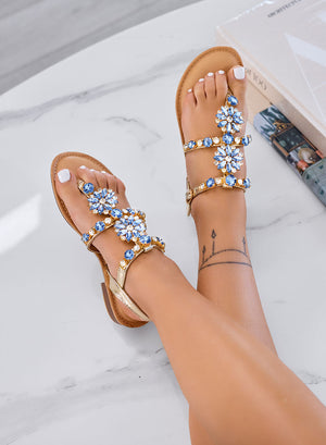 GIULY – Flat gold sandals with light blue gemstone embellishments