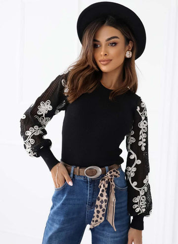 Black sweater with perforated sleeves and embroidery