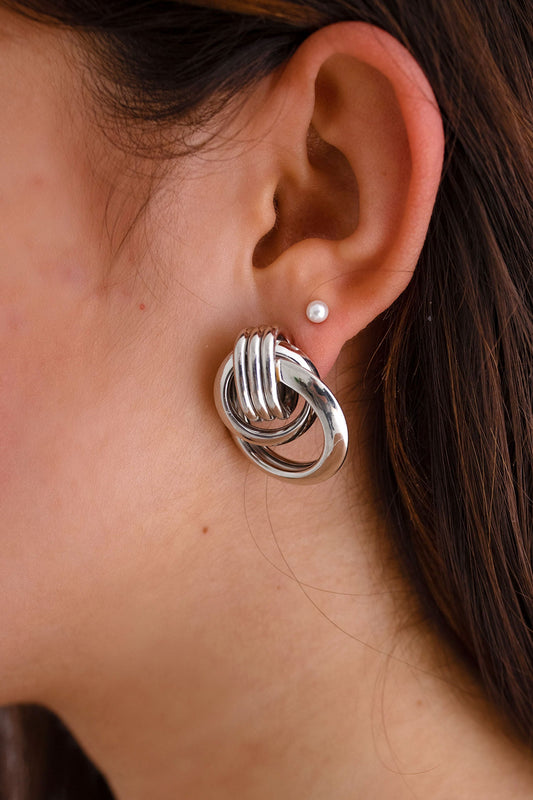 Silver earrings with button fastening
