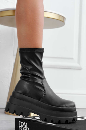 Black ankle boots with high wedge