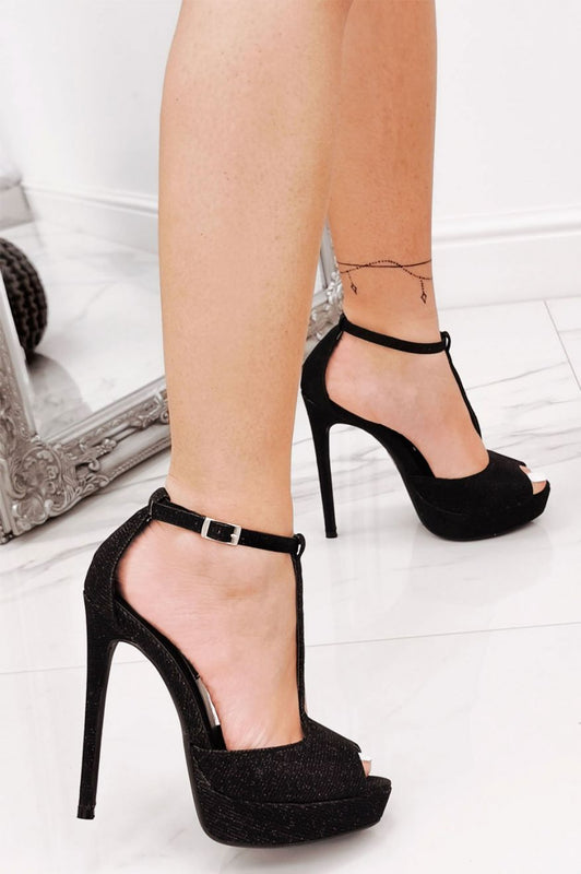 Black laminated sandals with high heels and T-straps Carla