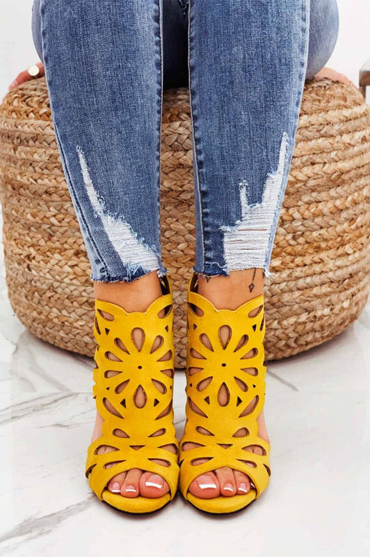 Yellow perforated sandals with comfortable heel
