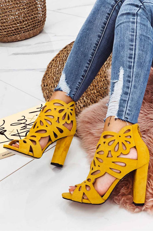 Yellow perforated sandals with comfortable heel