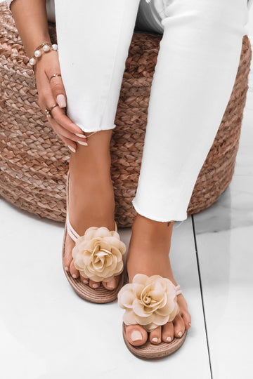 Beige slide sandals with applied flower
