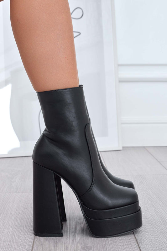 Black ankle boots with high heel and platform