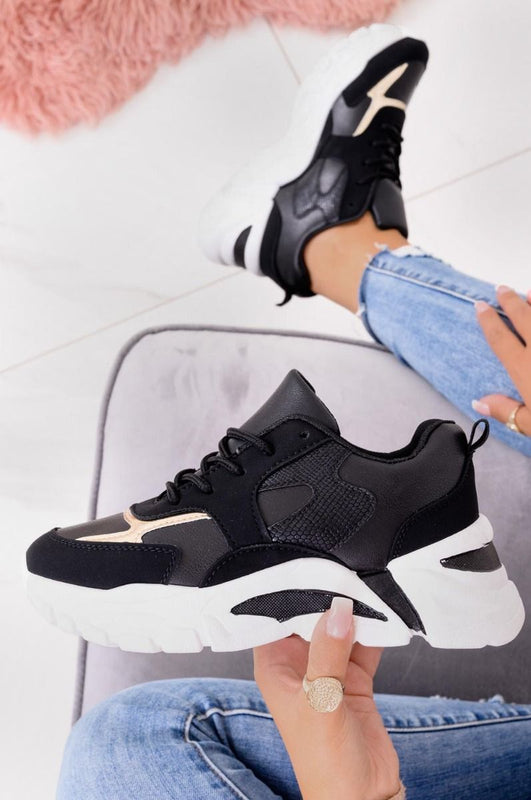 Baskets noires à semelle épaisse et inserts dorés