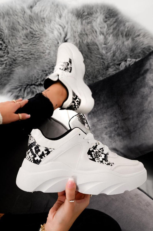 White sneakers with python-effect inserts and laces