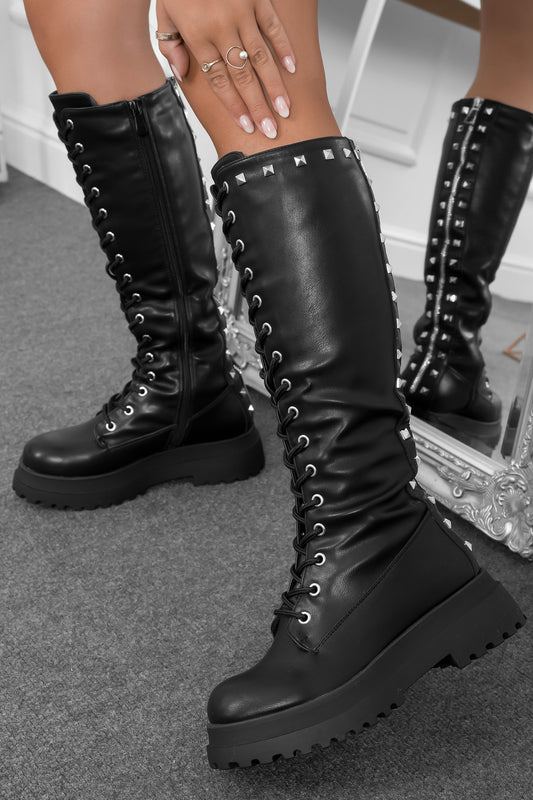 Black combat boots with studs and back zipper