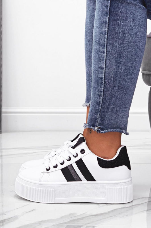White sneakers with laces and black glitter inserts