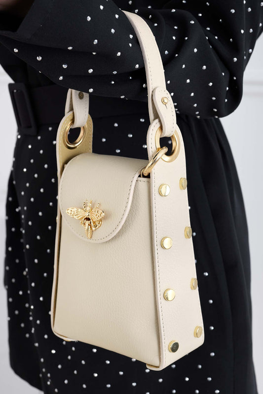 Beige handbag with gold studs and removable shoulder strap